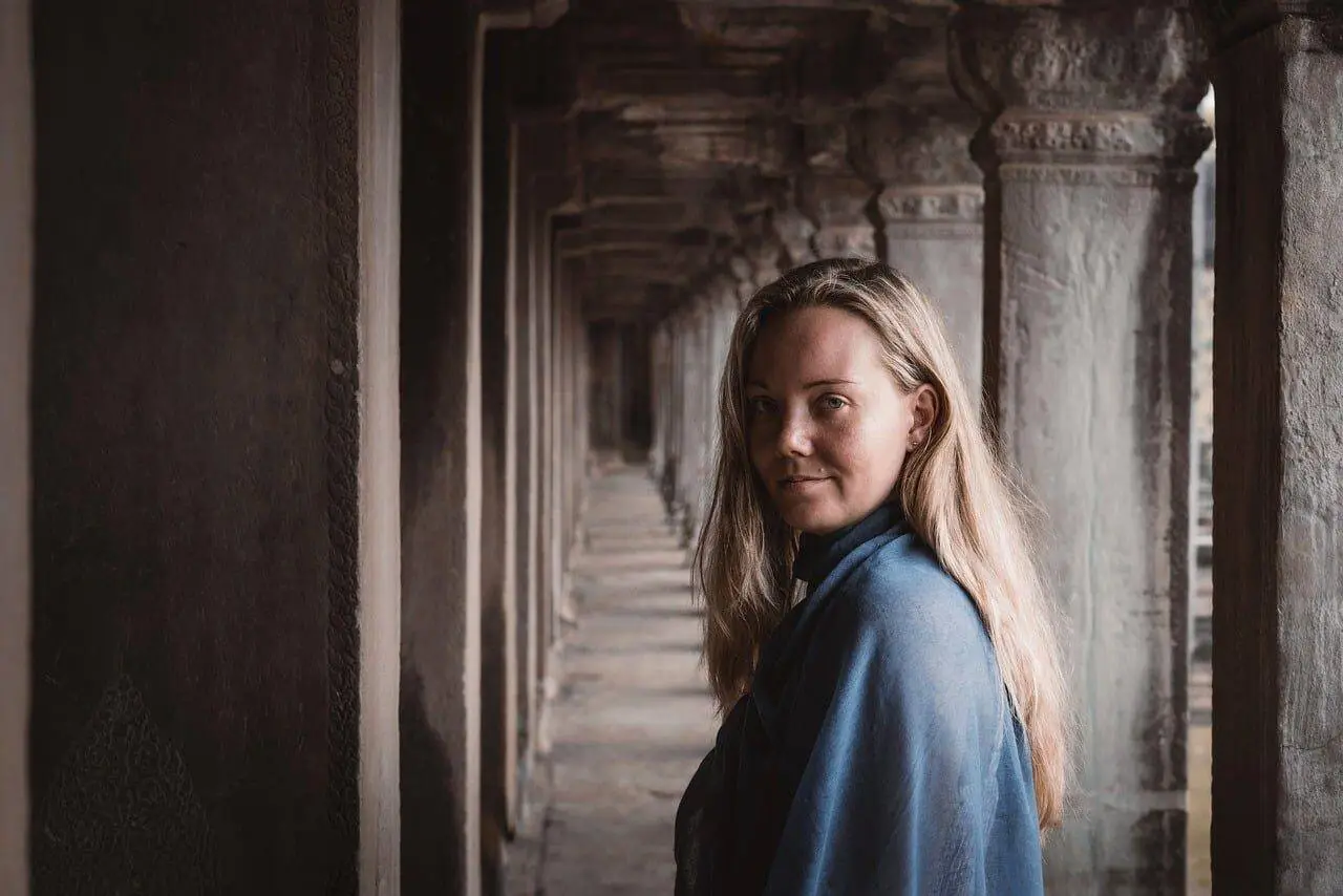 angkor wat, temple corridor, solo traveler, peaceful scene, khmer temple, cultural explorer, corridor symmetry, timeless beauty, phone wallpaper, destination inspiration, 4k, tourist, medieval architecture, tourist attraction, ancient history, natural light, photography, portrait, zen feeling